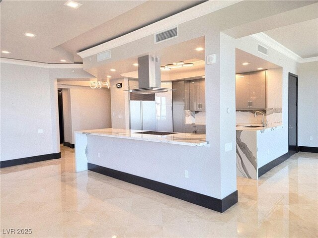2777 Paradise Rd Unit 2701Ph, Las Vegas, NV 89109 - kitchen with ornamental molding, island range hood, recessed lighting, black electric stovetop, and backsplash