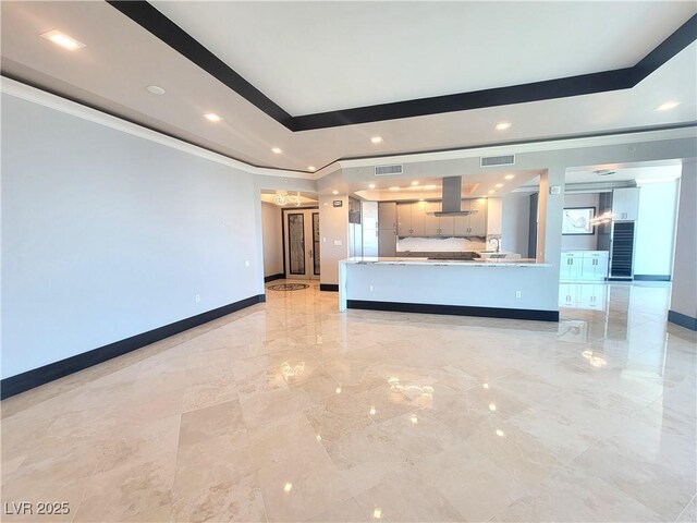 2777 Paradise Rd Unit 2701Ph, Las Vegas, NV 89109 - unfurnished living room with ornamental molding, recessed lighting, a raised ceiling, and light marble finish flooring