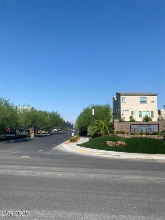 8056 Haywood Estate Ave, Las Vegas, NV 89113 - view of asphalt street with curbs and sidewalks