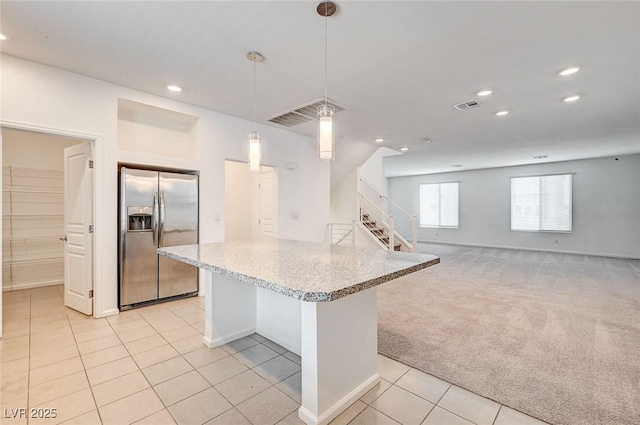 8056 Haywood Estate Ave, Las Vegas, NV 89113 - kitchen with stainless steel fridge, recessed lighting, light tile patterned floors, pendant lighting, and a center island