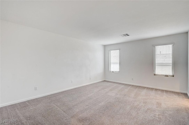 8056 Haywood Estate Ave, Las Vegas, NV 89113 - spare room featuring healthy amount of natural light, light colored carpet, and baseboards