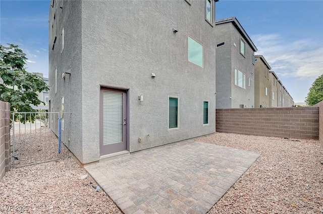 8056 Haywood Estate Ave, Las Vegas, NV 89113 - back of house with stucco siding and a fenced backyard