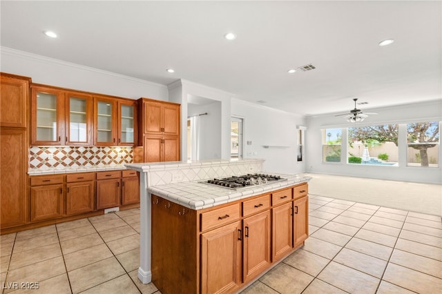 215 Great Gable Dr, Las Vegas, NV 89183 - kitchen featuring stainless steel gas stovetop, tile countertops, ceiling fan, light tile patterned floors, and recessed lighting