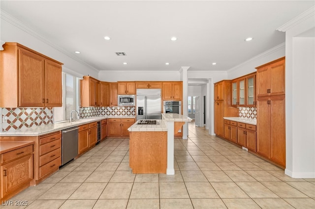 215 Great Gable Dr, Las Vegas, NV 89183 - kitchen featuring built in appliances, a center island, tasteful backsplash, glass insert cabinets, and light tile patterned flooring