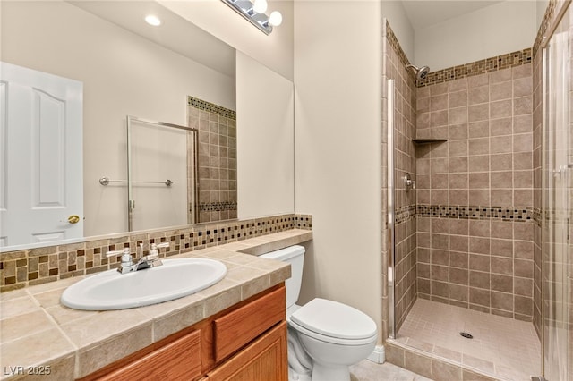 215 Great Gable Dr, Las Vegas, NV 89183 - bathroom with toilet, a tile shower, and vanity