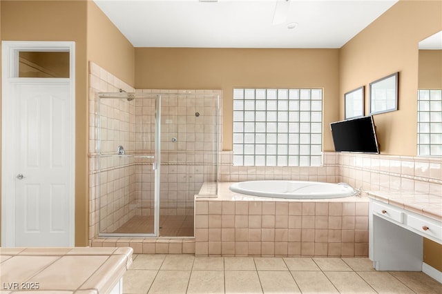 215 Great Gable Dr, Las Vegas, NV 89183 - bathroom featuring a shower stall, tile patterned floors, and a bath