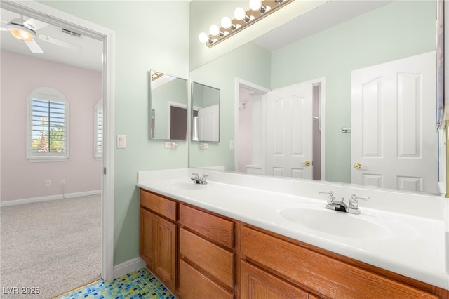 215 Great Gable Dr, Las Vegas, NV 89183 - bathroom featuring baseboards, a ceiling fan, and double vanity