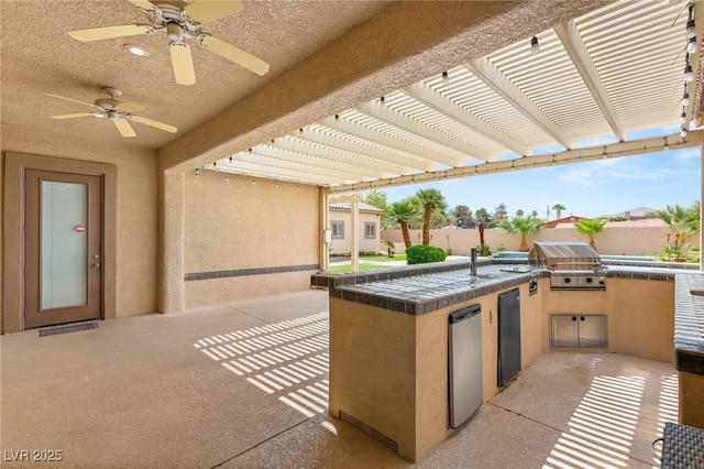215 Great Gable Dr, Las Vegas, NV 89183 - view of patio / terrace with a grill, exterior kitchen, a pergola, fence, and a ceiling fan