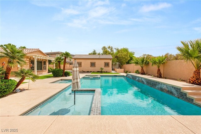 215 Great Gable Dr, Las Vegas, NV 89183 - view of pool featuring a fenced backyard, a pool with connected hot tub, and a patio