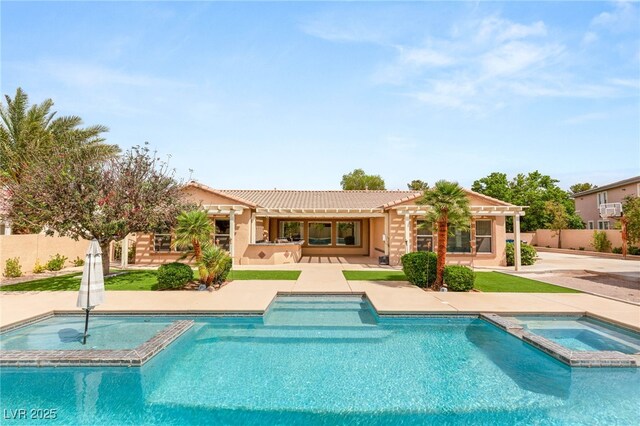 215 Great Gable Dr, Las Vegas, NV 89183 - view of pool featuring a pool with connected hot tub, a patio, and fence