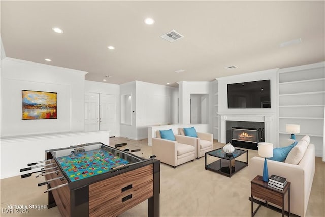 215 Great Gable Dr, Las Vegas, NV 89183 - rec room featuring recessed lighting, a glass covered fireplace, and light carpet