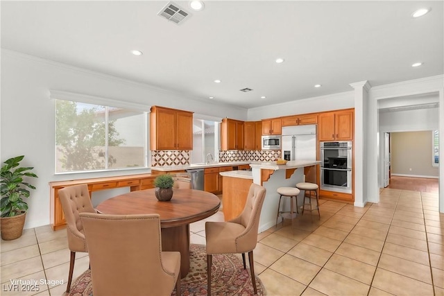 215 Great Gable Dr, Las Vegas, NV 89183 - dining space featuring light tile patterned floors, recessed lighting, and crown molding