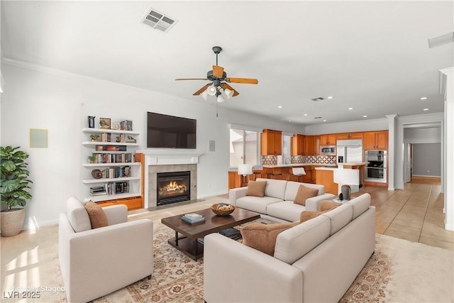215 Great Gable Dr, Las Vegas, NV 89183 - living area with ceiling fan, a fireplace, ornamental molding, recessed lighting, and baseboards