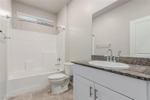 bathroom with toilet, vanity, and  shower combination