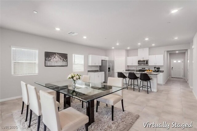 10257 Sequoia Falls Pl, Las Vegas, NV 89149 - dining room featuring baseboards and recessed lighting