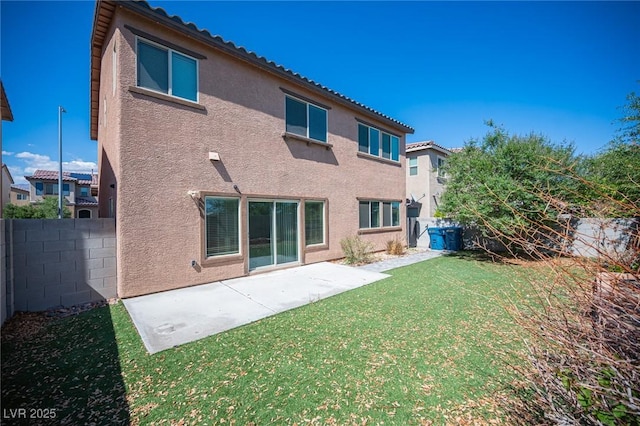 1405 Gilbert Creek Ave, North Las Vegas, NV 89031 - back of house with stucco siding and a patio area