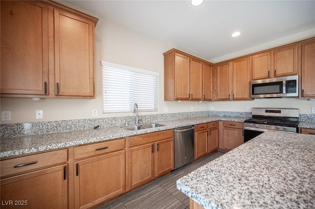 1405 Gilbert Creek Ave, North Las Vegas, NV 89031 - kitchen with stainless steel appliances, a sink, recessed lighting, and light stone countertops