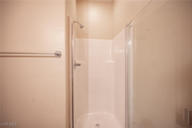 1405 Gilbert Creek Ave, North Las Vegas, NV 89031 - bathroom featuring a shower stall and a textured wall