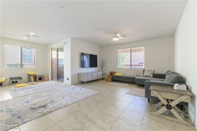 living area with light tile patterned floors and healthy amount of natural light