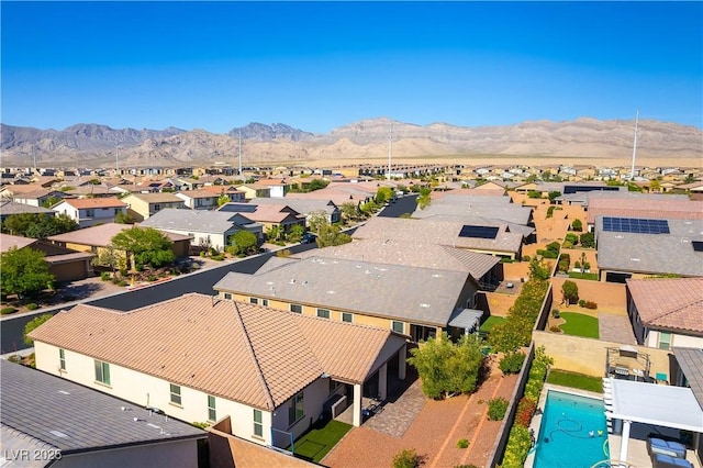 aerial perspective of suburban area featuring a mountain backdrop
