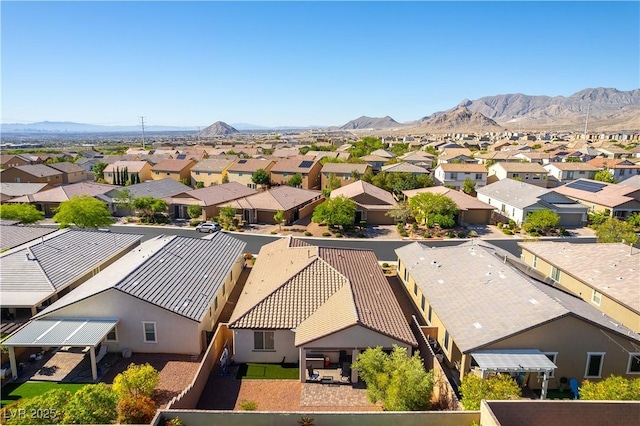 aerial perspective of suburban area featuring a mountain backdrop