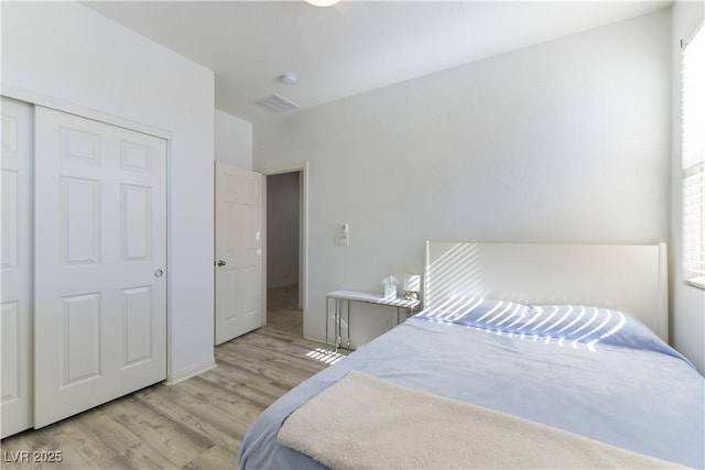 bedroom with light wood finished floors