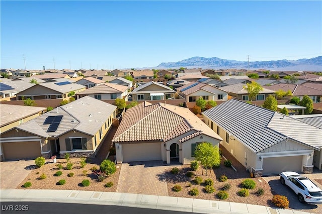aerial perspective of suburban area with a mountainous background