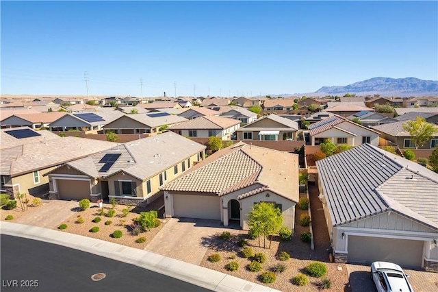 aerial view of residential area featuring a mountain backdrop