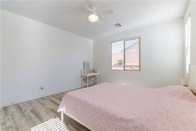 bedroom featuring wood finished floors and ceiling fan