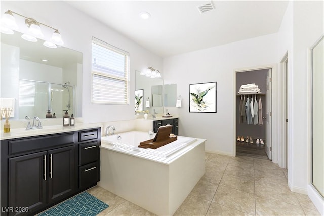 10742 Cowlite Ave, Las Vegas, NV 89166 - full bath with a shower stall, vanity, a garden tub, and tile patterned floors