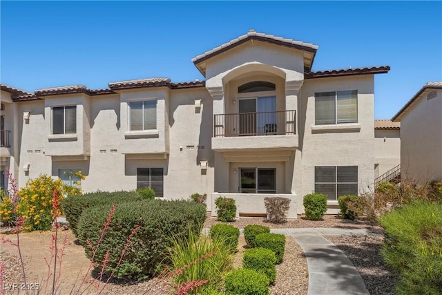 4821 Black Bear Rd Unit 101, Las Vegas, NV 89149 - view of front of home featuring a balcony, stucco siding, and a tile roof