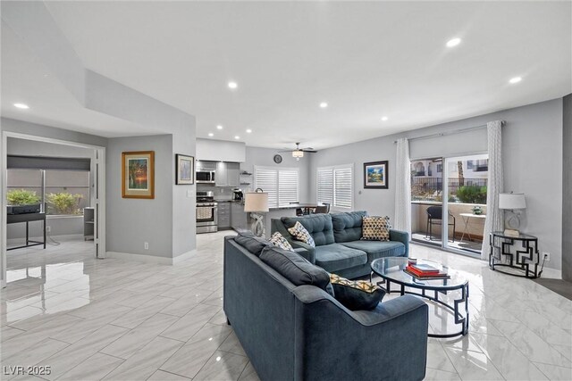 4821 Black Bear Rd Unit 101, Las Vegas, NV 89149 - living room featuring baseboards, light marble finish flooring, recessed lighting, and a ceiling fan