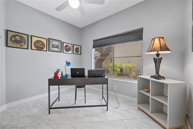 4821 Black Bear Rd Unit 101, Las Vegas, NV 89149 - home office featuring light marble finish flooring, a ceiling fan, and baseboards