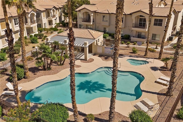 4821 Black Bear Rd Unit 101, Las Vegas, NV 89149 - community pool with fence, a residential view, and a patio area