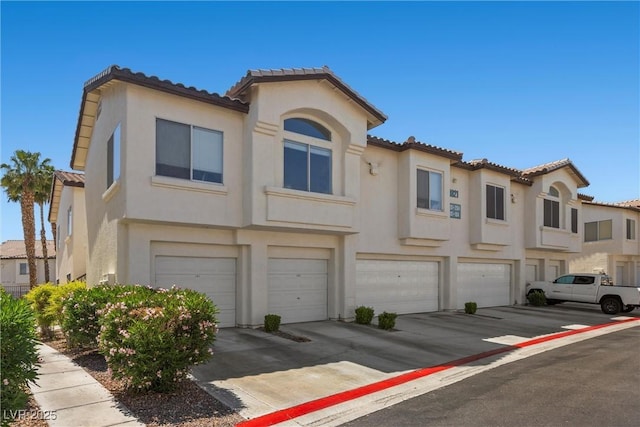 4821 Black Bear Rd Unit 101, Las Vegas, NV 89149 - multi unit property featuring a tiled roof and an attached garage