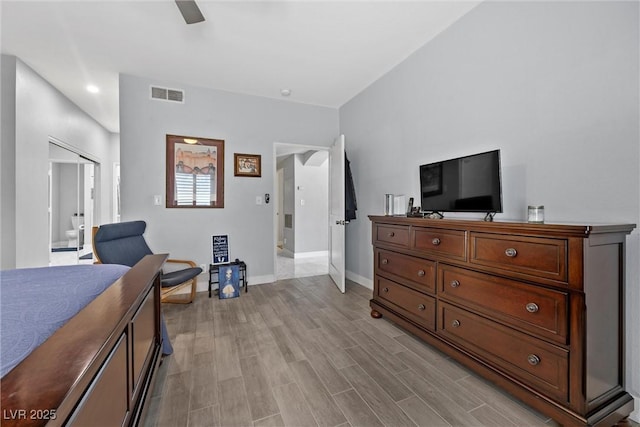 4821 Black Bear Rd Unit 101, Las Vegas, NV 89149 - bedroom with baseboards, light wood-type flooring, ensuite bathroom, and ceiling fan