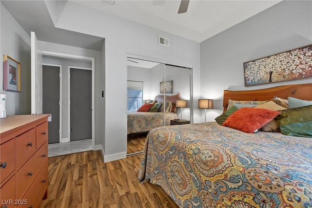 4821 Black Bear Rd Unit 101, Las Vegas, NV 89149 - bedroom with a closet, light wood finished floors, baseboards, and a ceiling fan