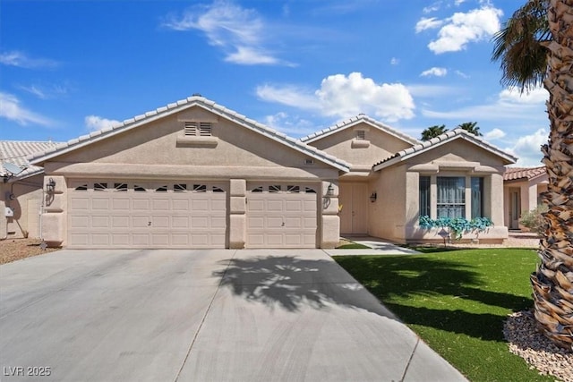 9096 Nomo St, Las Vegas, NV 89123 - view of front of house with concrete driveway, a garage, stucco siding, a front yard, and a tile roof
