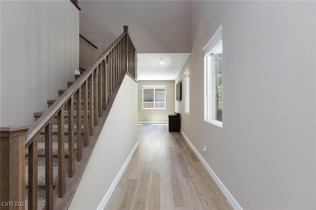 8873 Howell St, Las Vegas, NV 89166 - hall featuring wood finished floors, stairway, and baseboards