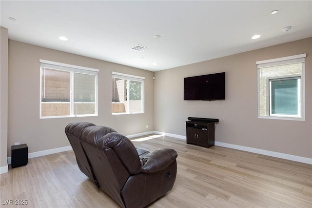 8873 Howell St, Las Vegas, NV 89166 - living room with light wood-type flooring, baseboards, and recessed lighting