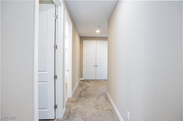 8873 Howell St, Las Vegas, NV 89166 - hall with light colored carpet, baseboards, and recessed lighting