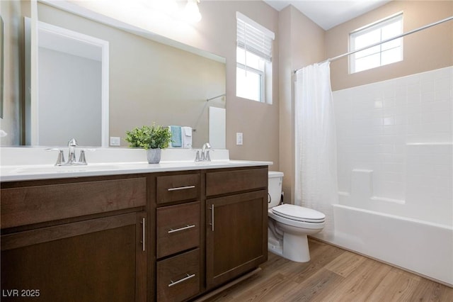 8873 Howell St, Las Vegas, NV 89166 - full bath with toilet, wood finished floors, healthy amount of natural light, and double vanity