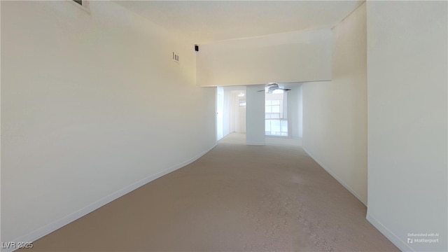 hall featuring baseboards