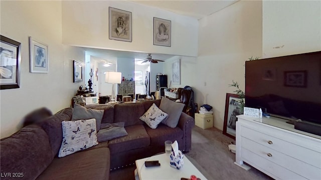 carpeted living room featuring ceiling fan