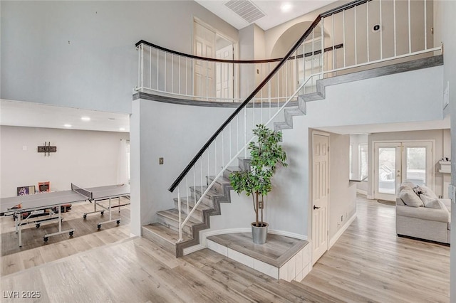 2224 Lucerne Ct, Henderson, NV 89014 - stairway with a high ceiling, wood finished floors, french doors, baseboards, and recessed lighting