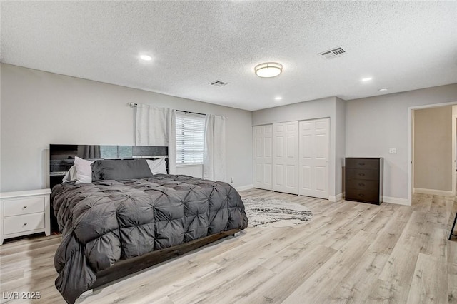 2224 Lucerne Ct, Henderson, NV 89014 - bedroom with light wood finished floors, a closet, a textured ceiling, baseboards, and recessed lighting