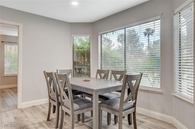 2224 Lucerne Ct, Henderson, NV 89014 - dining space with light wood-type flooring, baseboards, and healthy amount of natural light