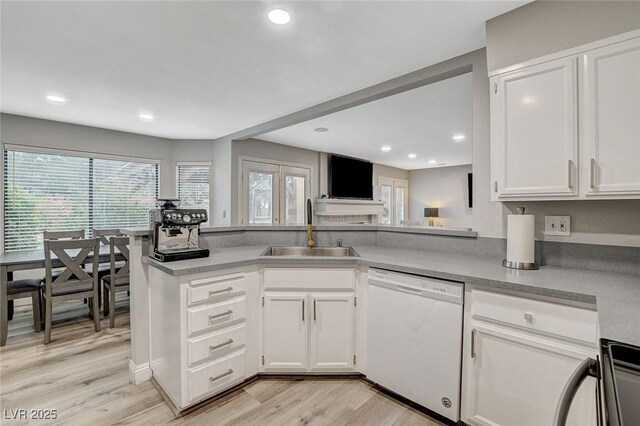 2224 Lucerne Ct, Henderson, NV 89014 - kitchen featuring white dishwasher, a sink, healthy amount of natural light, white cabinetry, and recessed lighting