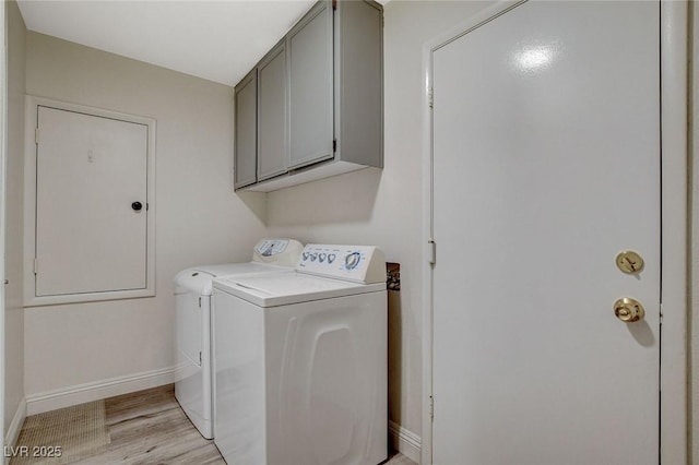 2224 Lucerne Ct, Henderson, NV 89014 - washroom featuring washing machine and dryer, baseboards, cabinet space, and light wood-style floors