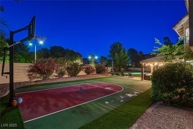 2224 Lucerne Ct, Henderson, NV 89014 - view of basketball court with basketball hoop, a gazebo, and a fenced backyard